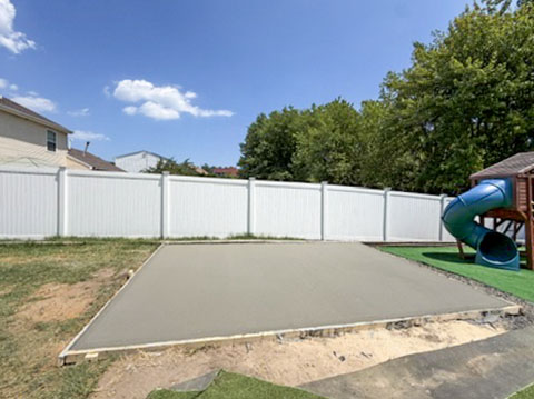 Prepared and poured backyard concrete patio base